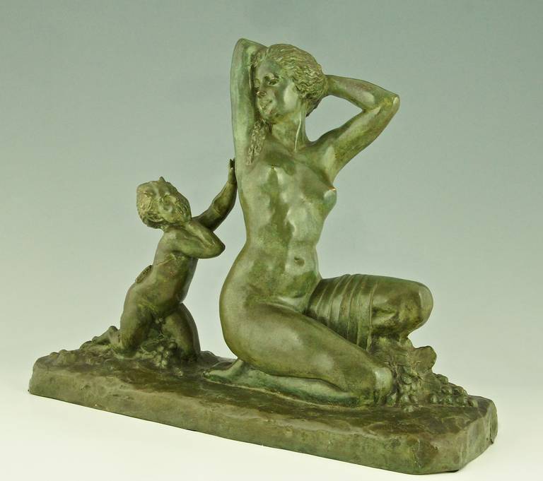 Art Deco sculpture of a seated nude with satyr. 
By  Alfred J Foretay. 

Style:  Art Deco
Date:  circa 1920.
Material:  Green patinated bronze.
Origin:  France.
Size:			 
H. 14.1 inch x L. 17.3 inch x W. 7.2 inch.   
H. 36 cm  x L. 44.5 cm