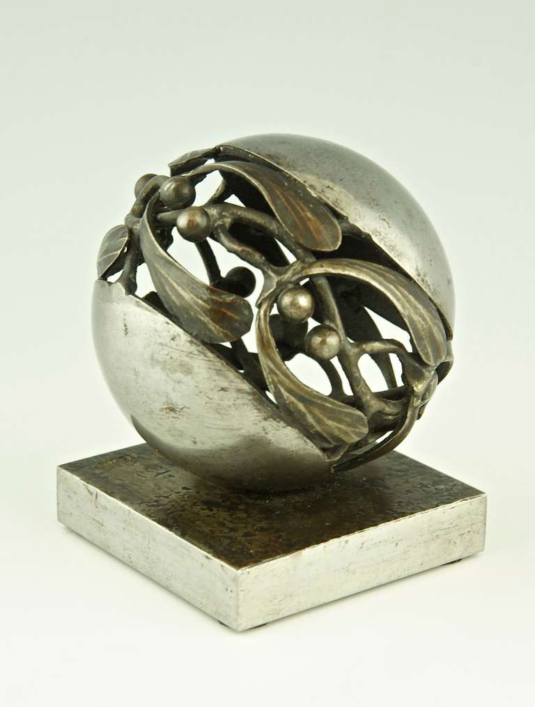 An Art Deco wrought Iron Mistletoe paperweight by Edgar Brandt, 1921.