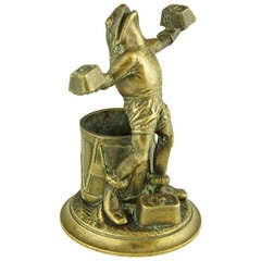 Antique bronze of a frog lifting weights by Malide.