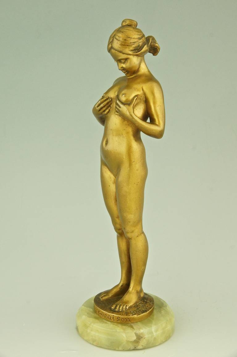 “La comparaison.” 
A bronze of a young girl comparing her breasts. 
Artist:  Antoine Bofill, worked in France 1895-1925.
Signature & Marks:  Bofill.  Patrouiileau éditeur, Paris.  Bronze. 

Style: Art Nouveau. 
Date:  1905. 
Material:  Gilt