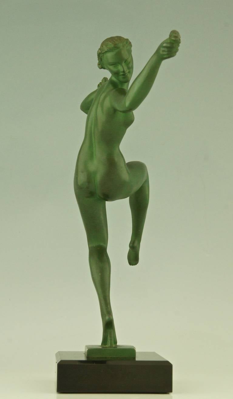 Patinated Art Deco sculpture Dancing Nude with Flowers by Fayral, Pierre Le Faguays, 1930