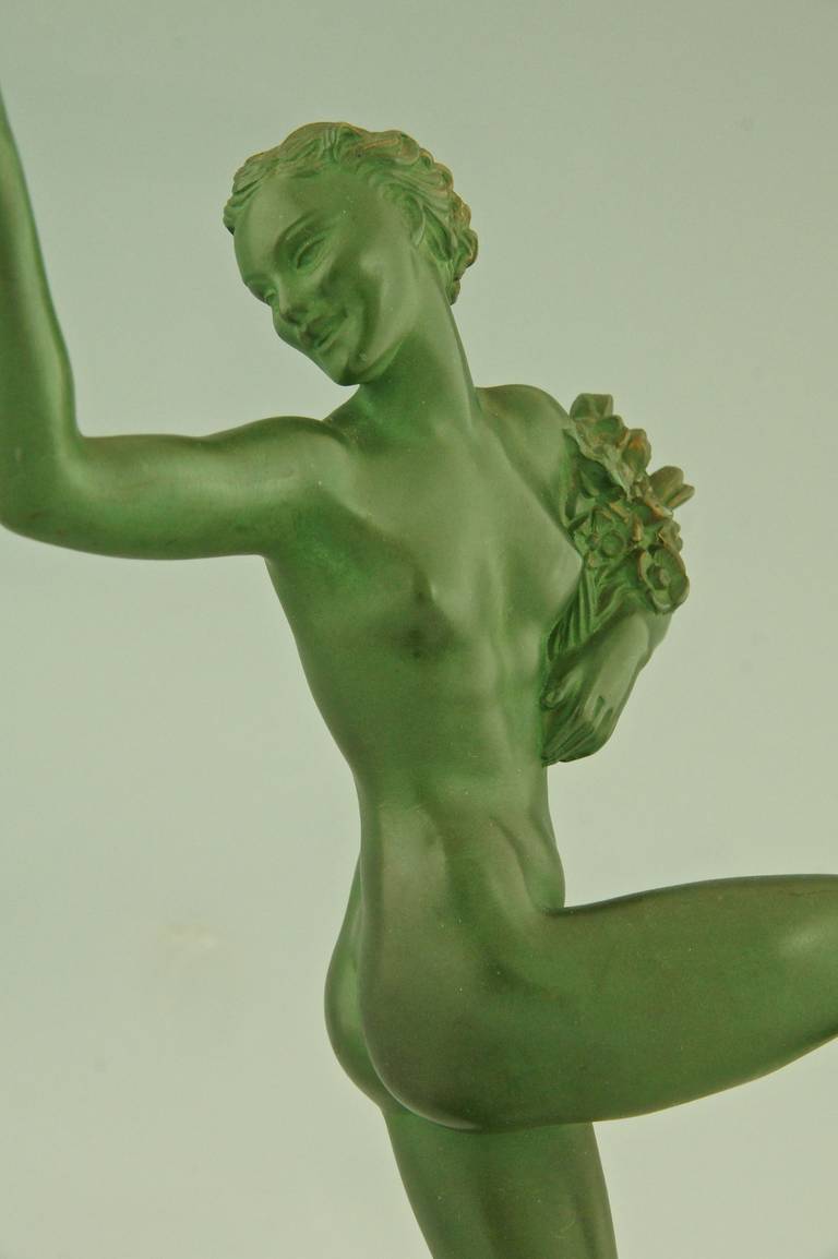 20th Century Art Deco sculpture Dancing Nude with Flowers by Fayral, Pierre Le Faguays, 1930