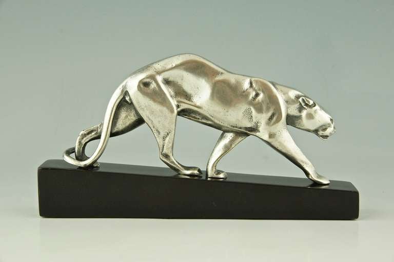Walking panther by  Maurice Prost. 
Signature / Marks:  M. Prost, Susse frères éd. Paris. 
				
Size:		
L. 7.2 inch. x H. 3.7 inch x W. 1.2 inch.	 
L. 18.4 cm. x H. 9.5 cm  x W. 3 cm.   
 
Literature: 
The dictionary of sculptors in bronze