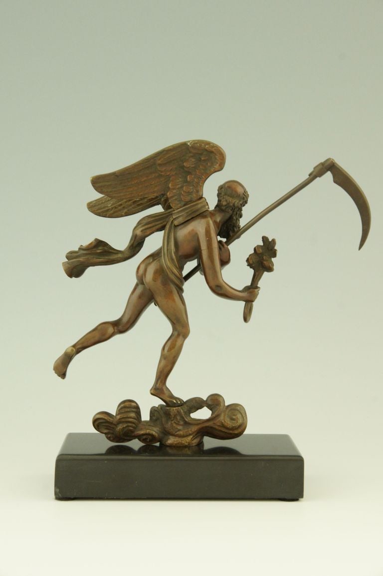 Antique bronze watch holder on a marble base
