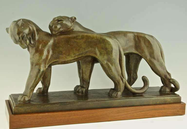 Art deco bronze sculpture of two panthers. 
By  André Vincent Becquerel,
Signature / Marks:  A. Becquerel.

Style:  Art Deco.	
Date:  Ca.1925.
Material:  Bronze on a wooden base.	
Origin:  France. 			

Size:			
L. 22.6 inch. x H. 14.8 inch