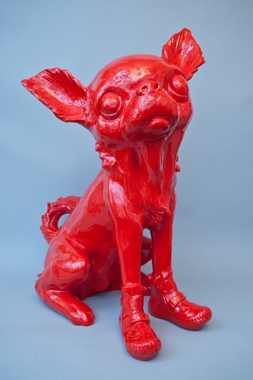 A red resin sculpture of a sitting Chihuahua.

Signature: William Sweetlove and numbered 18/20.

This model is illustrated on page 82 of “Mayday, Mayday... I said no, no, no. William Sweetlove.
