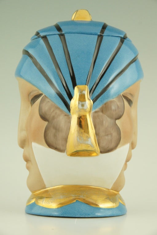 Bonbonniere or sweet jar with womans head, double face. 

Signed: Robj, Paris. Made in France. 

“Art Deco Keramik” by Norbert and Georgette Poulain. Exhibition 1981.
”Craquelés” by Patrick Malaureille, Massin Editeur.
“The world of Art Deco” 