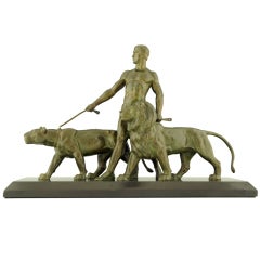Scultura in bronzo Art Deco di un uomo con leoni di Ouline
