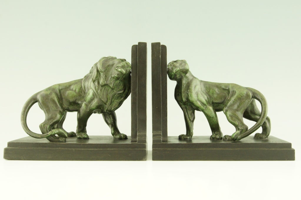 Fedex shipping:$ 125

Pair of Art Deco figural lion bookends signed Carlier depicting a male and female lion.
Light and dark green patinated white metal ca 1920.

Foundry seal Paris France.

Literature: “Art deco sculpture” by Victor Arwas,