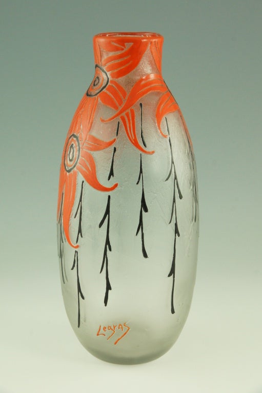 Cameo glass vase with textured background decorated with raised Art Deco floral design. Hand enameled with orange and black flowers.

Literature:“Glass, art nouveau to art deco” by Victor Arwas, Academy. 
“Lampen und Leuchter, Art Nouveau Art