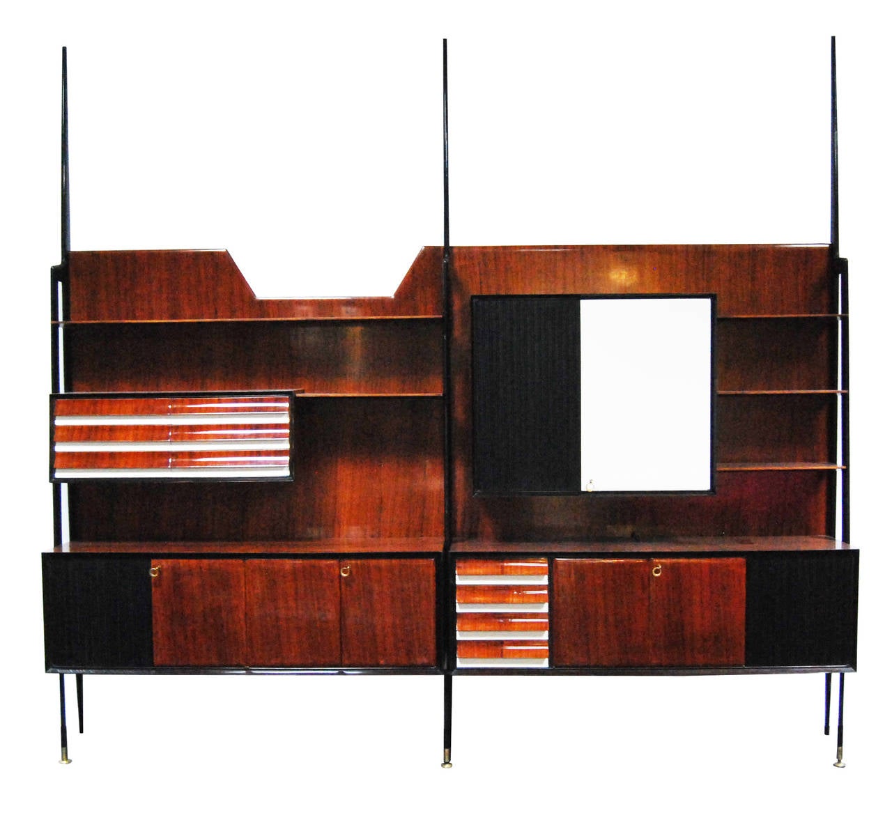 Rosewood italian cabinet / wall unit by Vittorio Dassi,  composed of two top panel with shelves, six drawers and a hidden bar; and two lower case with seven doors and four drawers.