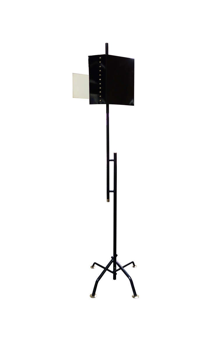Floor lamp edited by Stilnovo.  Painted metal structure with brass details.