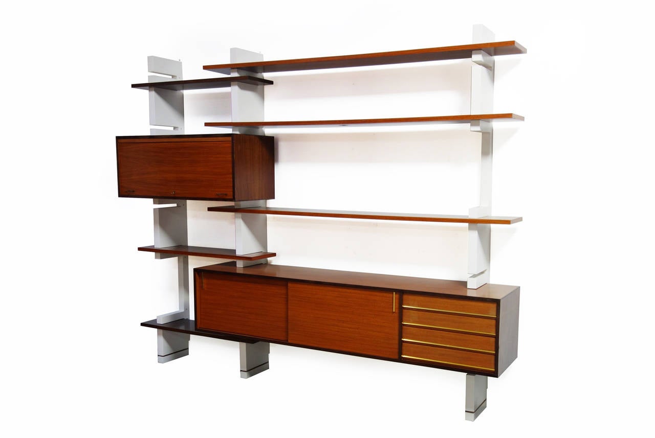 Wall unit by Amma, Turino, Italy, 1960s.

Lacquered walnut with brass details, white lacquered supports.