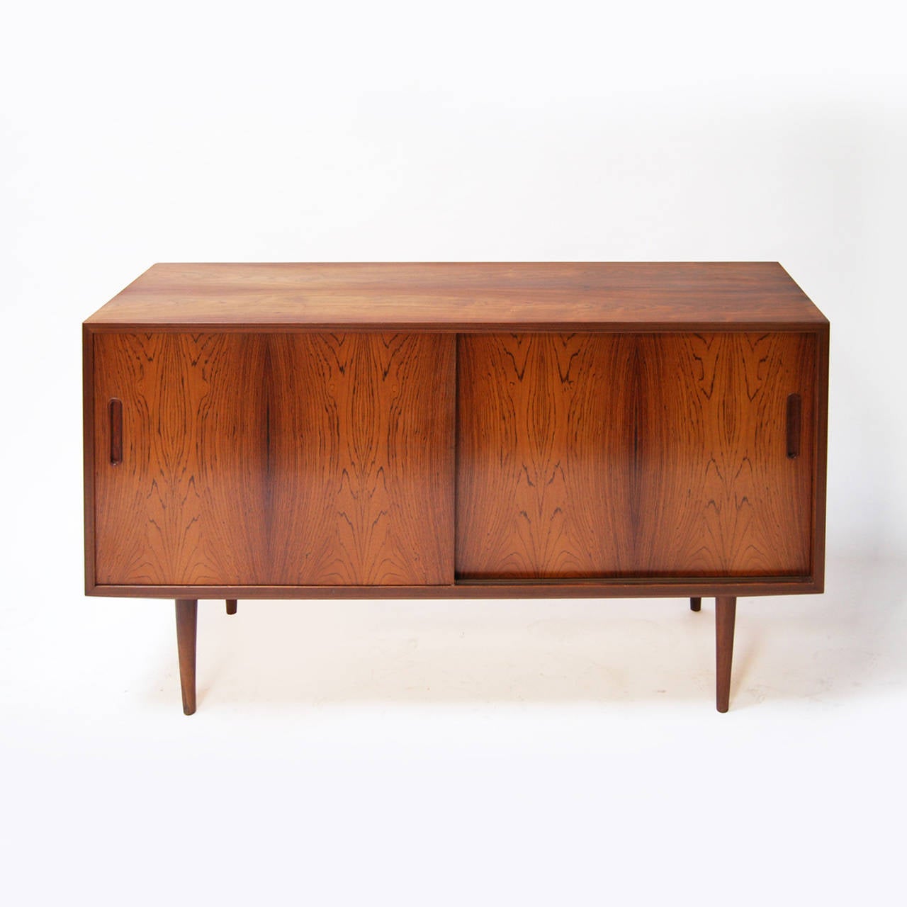 Small Danish dresser, with sliding doors, two shelves and a drawer.

With a small footprint it is an ideal piece for small space.

Made in Denmark, 1950s.