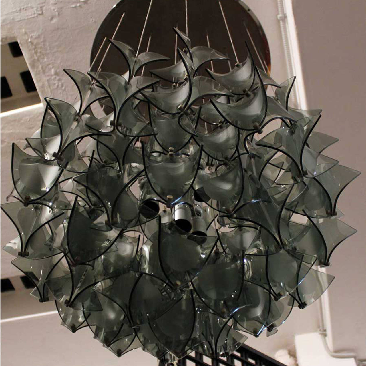 Fantastic Italian chandelier. Made of smoked crystal modules, hanging from metal wire and fixed by brass closing system.
