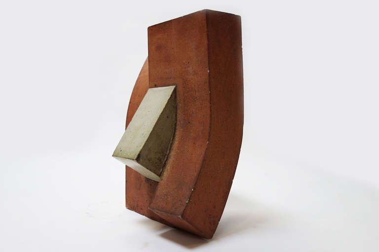 Geometric sculpture in clay with enameled details.

Monogrammed 