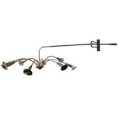 Iron and brass mobile wall light with counterweight