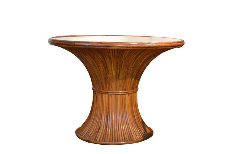Circular dining room bamboo table by Gabriella Crespi.
Table with radial bamboo decoration, brass plate in the center and glass table top. Part of the 