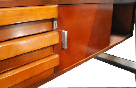 Office desk with a main veneered rosewood table. Two side boxes in veneered rosewood. Set of 3 original keys. On the left side, you will find next to the drawer box, slide doors for archives. 
On the back you will find two open boxes. The structure