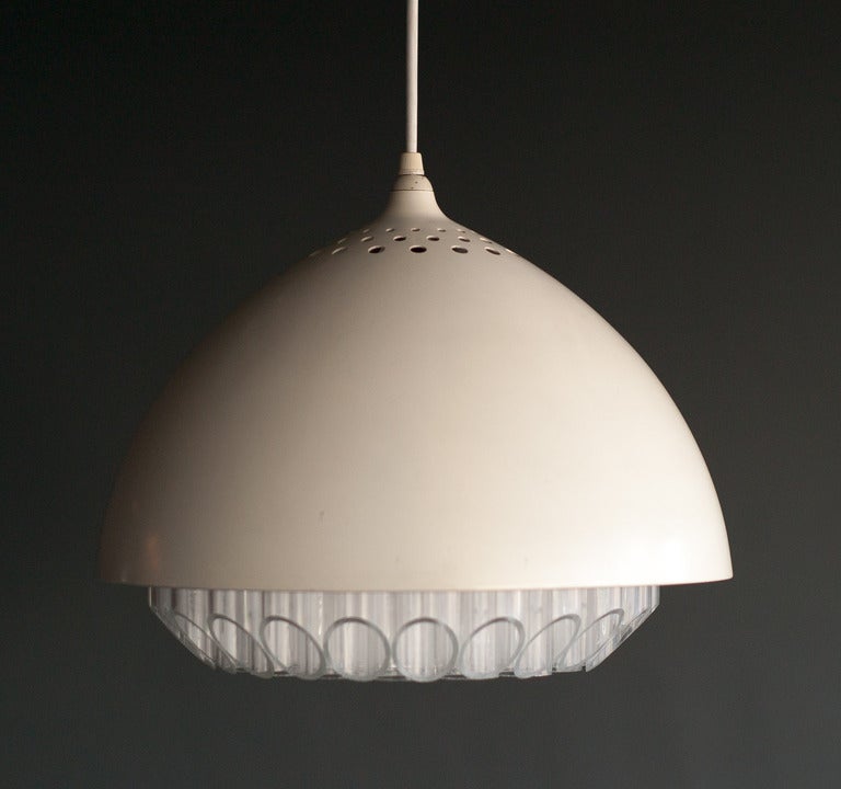 White enameled aluminum half dome fixture with acrylic interior. 
Manufactured by Nessen for only a few years.
Wonderful example of the distinctive feature of acrylic to channel light, as shown in the first picture. Another example of this effect