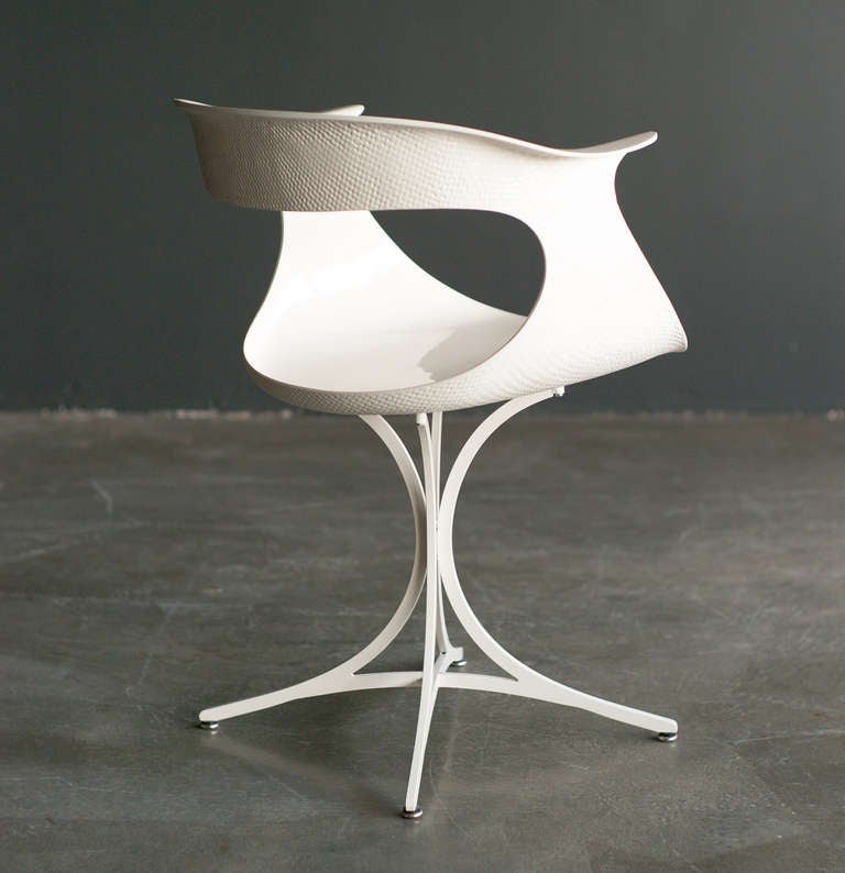 Lotus chair designed in 1958 by Erwine & Estelle Laverne. Fiberglass seat with textured exterior resting on white enameled steel base. Base and seat have been professionally refurbished to give the chair back its original lustre.
We offer museum