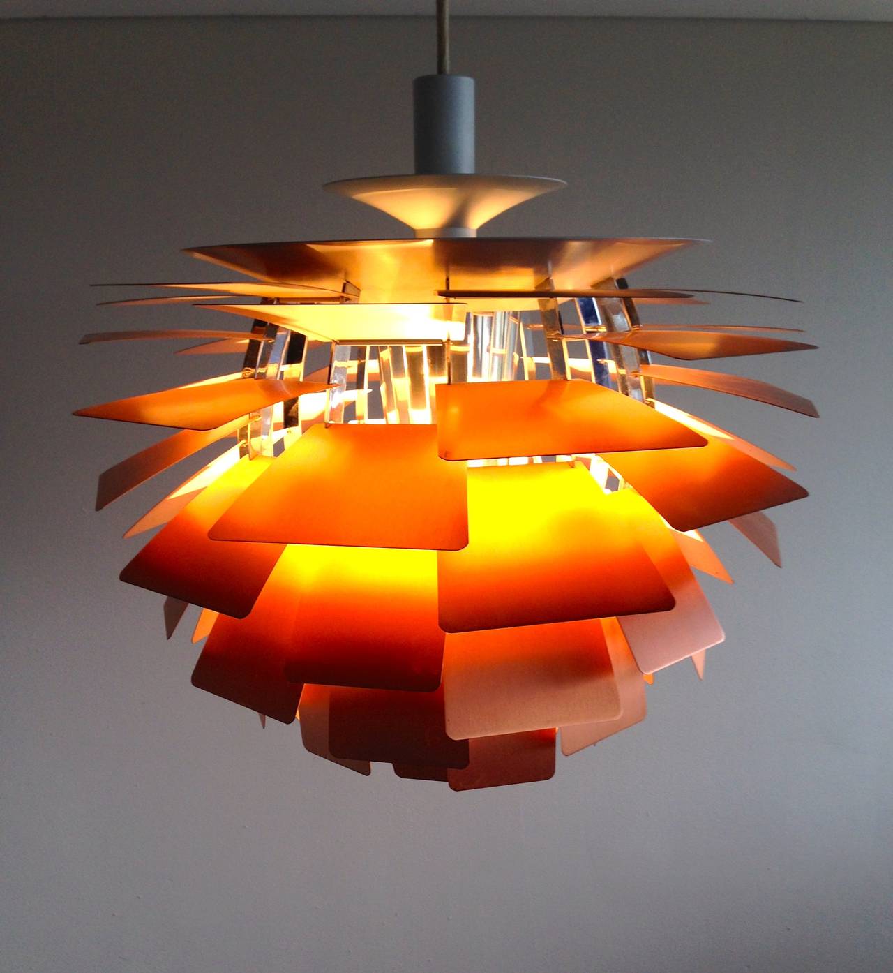 The PH Artichoke is considered to be a masterpiece of mid century modern design by Poul Henningsen for Louis Poulsen Denmark.
This particular lamp is from the 1970s with the single steel wire mount. The one and only you would want!

Competitive