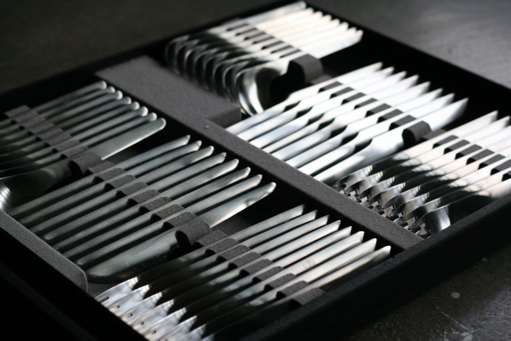 Complete flatware set designed by Arne Jacobsen for A. Michelsen in original suitcase. 
This futuristic flatware became well known after being used in Stanley Kubrick's movie '2001: A Space Odyssey'.