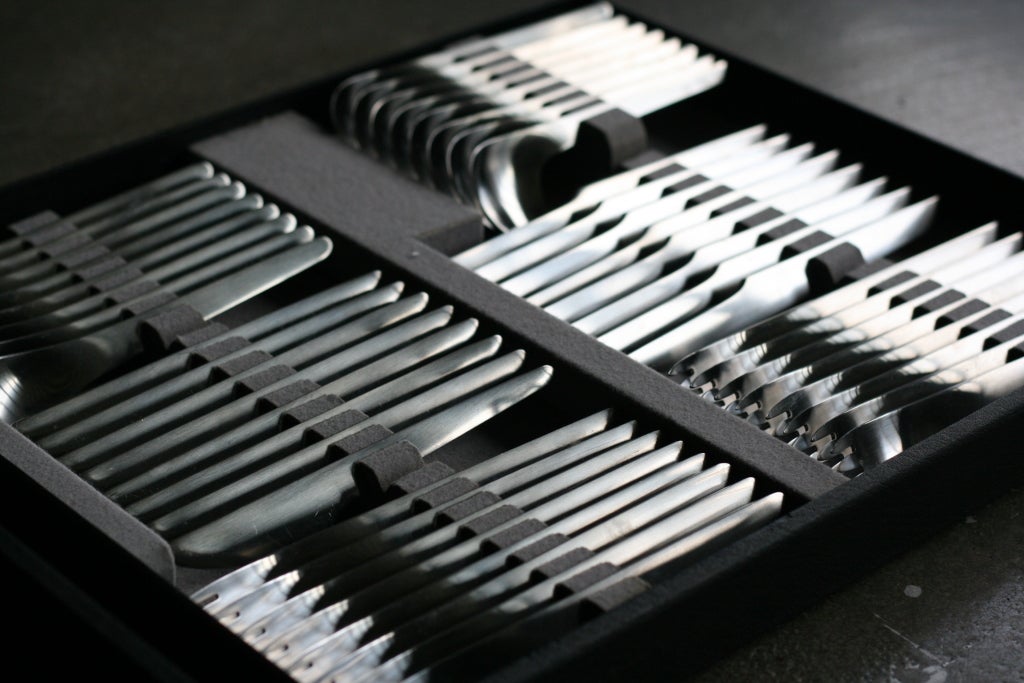 Complete Arne Jacobsen flatware set in original suitcase.