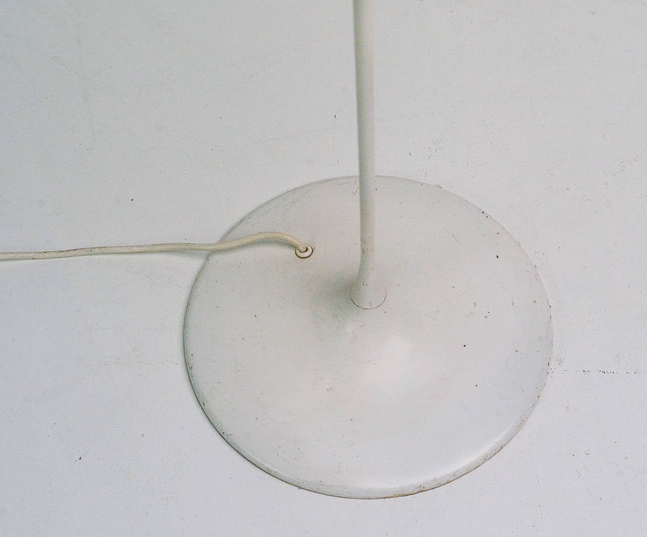 A white enameled spun metal torchière floor lamp by architect Max Bill (1908-1994) for B.A.G Turgi, Switzerland, circa 1960. Max Bill is widely considered the single most decisive influence on Swiss graphic design beginning in the 1950's with his