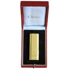 Briquet stylé en plaquettes d'or Cartier des années 1970