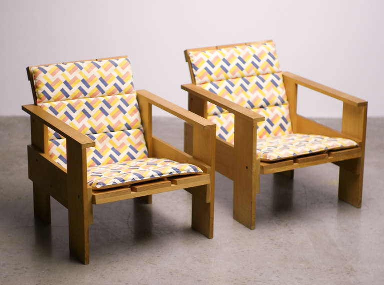 Great pair of early 1970's Cassina Crate Chairs designed by Gerrit Rietveld, with very rare matching original cushions, designed by Djo Bourgois. Marked with Rietveld stamp and numbered 187 and 189.

Reference:
The Complete Rietveld Furniture by