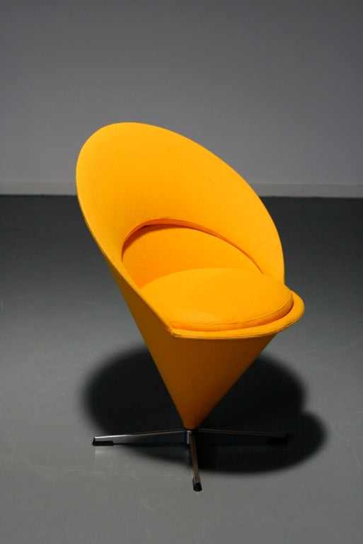 Cone chair upholstered in yellow Tonus fabric by Kvadrat.
Manufactured by Plus Linje.