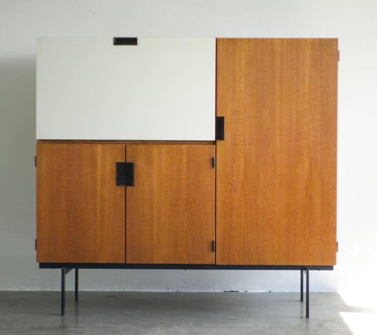 Beautiful cabinet in the most desirable version with elegant black enameled steel frame with thin legs. Very good original condition.
We offer museum quality crating and affordable worldwide shipping. Feel free to inquire!