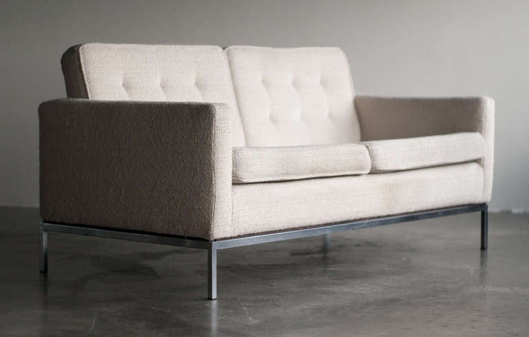 Designed in 1954 by Florence Knoll for Knoll International. This example made in the 1960's. Original wool upholstery in nice vintage condition, considering the age. Foam still soft and resilient. Matching 3-seater also available.