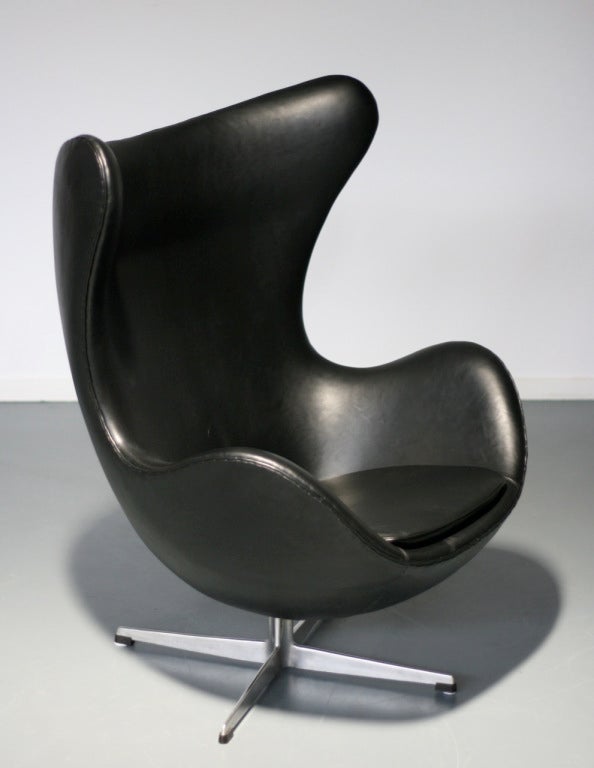 Egg Chair from circa 1965 in black colored leather. 
The chair has recently been reupholstered by the finest Danish upholsterer available in Europe.