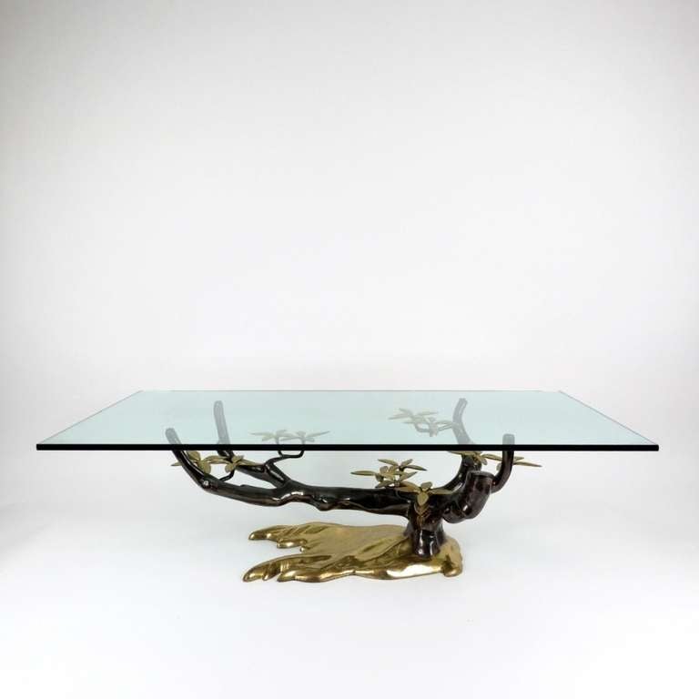 Fantastic bronze,black,gilded coffee table by Willy Daro in tree form.
Organic designed table with thick glass square top edged corners. 
Bronze in good and clean condition,top in used minor wear condition. (1chip).