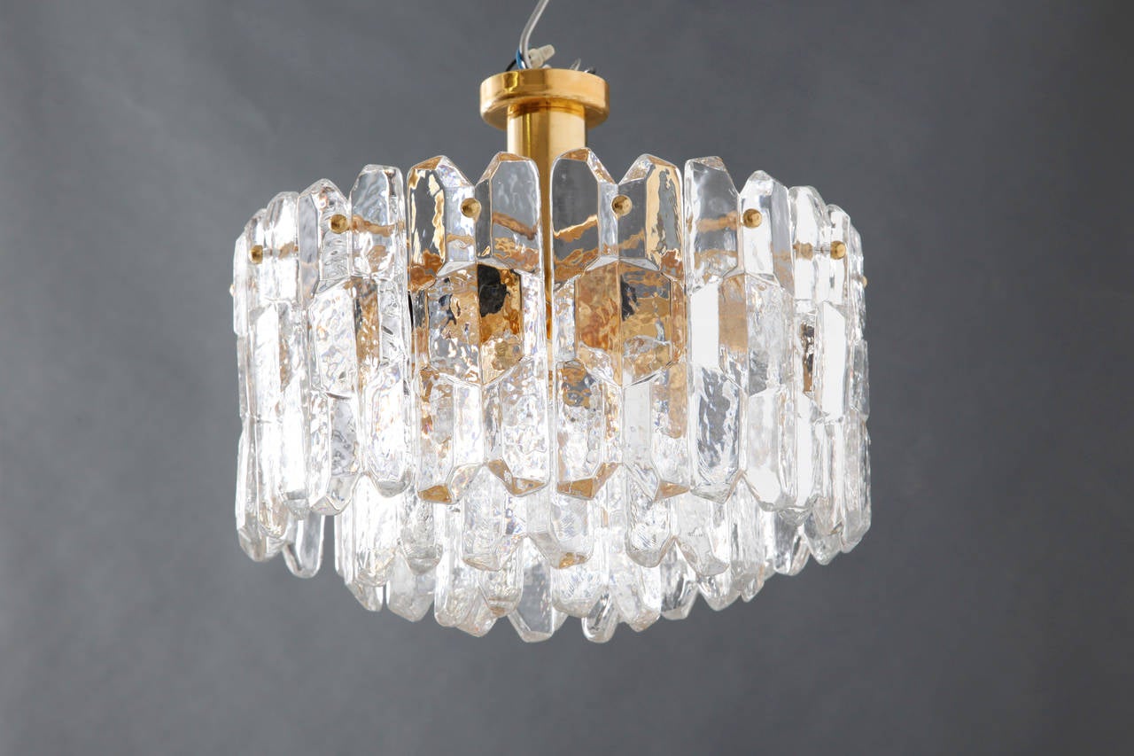 Stunning three tiered Austrian Kalmar Chandelier in excellent condition.With 8 bulb sockets this light illuminates beautifully. 
Shipping is complimentary.