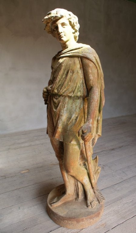 cast-iron life-size figure with a beautiful patina for your garden, casted in three pieces meaning the right arm and the stick are joined after the (unknown foundry) casted this beautiful boy