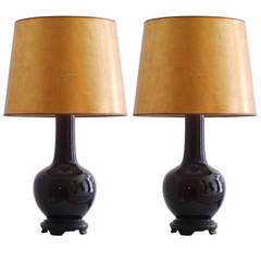 Pair of 1970 ceramic table lamps with gilded paper shades.