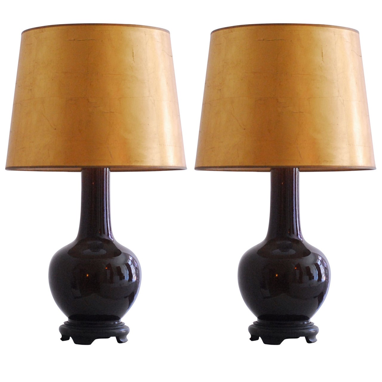 Pair of 1970 ceramic table lamps with gilded paper shades. For Sale