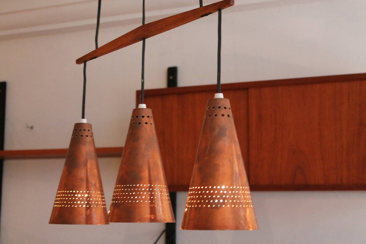 Hans Agne Jacobsen pendant lamp Markaryd, Sweden, 1960s

made in copper and fine teakwood ,with original canopy in copper 
rewired also for US use 

great working condition with really nice patine 

we ship world wide , please contact us for