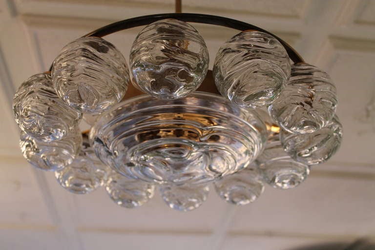 Doria pendant  or ceiling lamp Germany 1960's.  12 glass balls and a nice shaped disc on a brass frame.  Can be used as pendant lamp or as ceiling lamp (without the stem).  Good working condition also wired for US use.