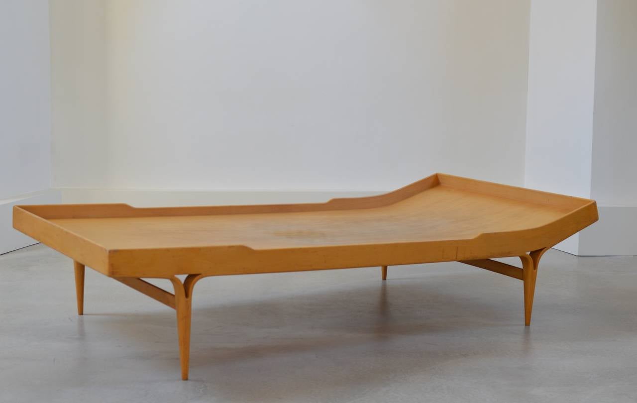 Birch and beech plywood daybed model T303 also known as the 'Berlin' daybed since it was first presented at the International Building Exhibition in Berlin in 1957 by Bruno Mathsson for Karl Mathsson, Sweden from 1961, according burn marking. 
The
