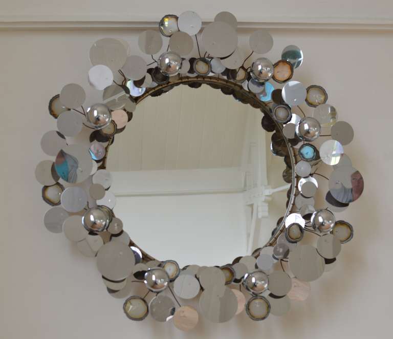 Wall mirror object of punched and torch cut polished chrome discs and domes. 
Signed and dated.