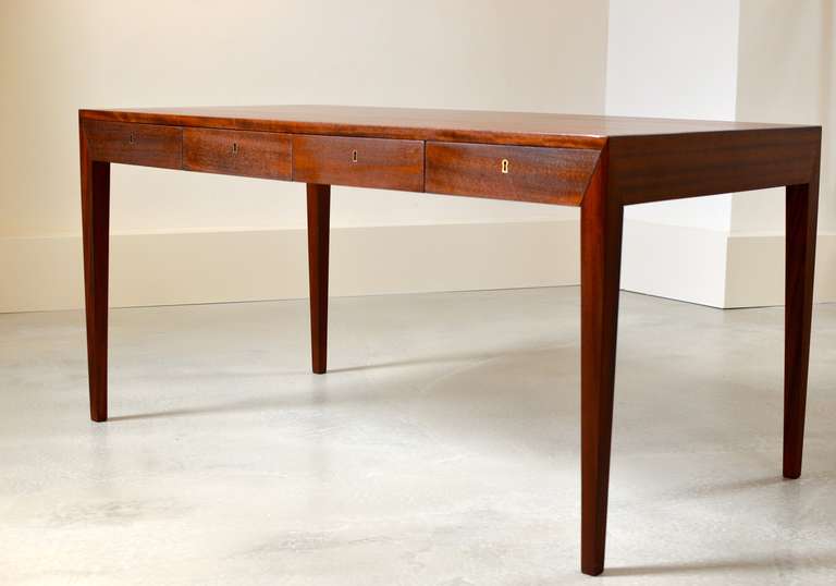 Beautiful refined desk by Severin Hansen Jr. for Haslev Denmark. 
Early 1950's edition (signed with paper label to underside), executed in 
Mahogany with brass keyholes.