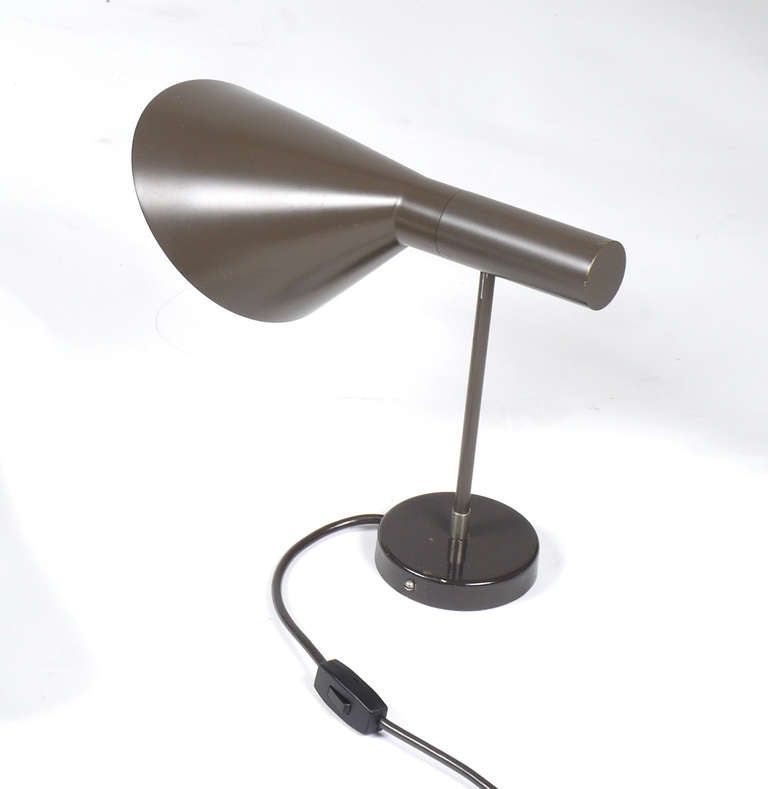 Pair of large grey-brown adjustable AJ Visor wall lamps by Arne Jacobsen for Louis Poulsen with cord switches and plugs. 
Price for the pair.  

Measures: 
Depth 35 cm
Length 30 adjustable to 50 cm
Diameter shades: 18 cm