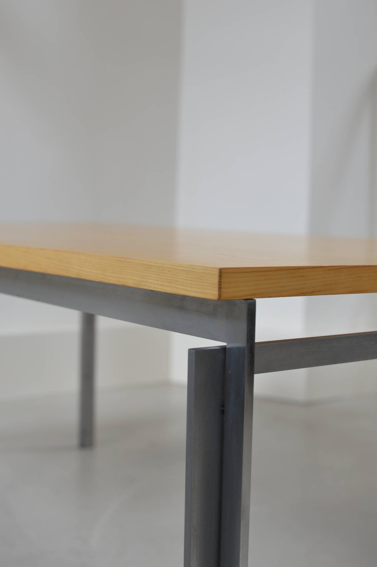 Exceptionally well preserved example of iconic work / dining table model PK55 designed by Danish architect Poul Kjaerholm in 1957, manufactured by Ejvindt Kold Christensen according markings logo on frame (photographed). 

Beautiful wood grain ash