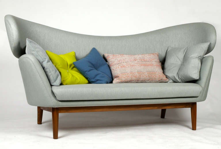 Originally designed by Finn Juhl in 1951 for Baker Furniture Inc. USA and reissued in 2010 by license holder One Collection from Denmark. This is one of the first sofa's ordered in 2010 and hardy used / as new.  

The sofa has an upholstered body