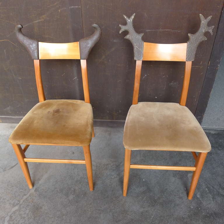 Two chairs in cherry wood with sculpted wood details with the label Nord Sud
made in France.