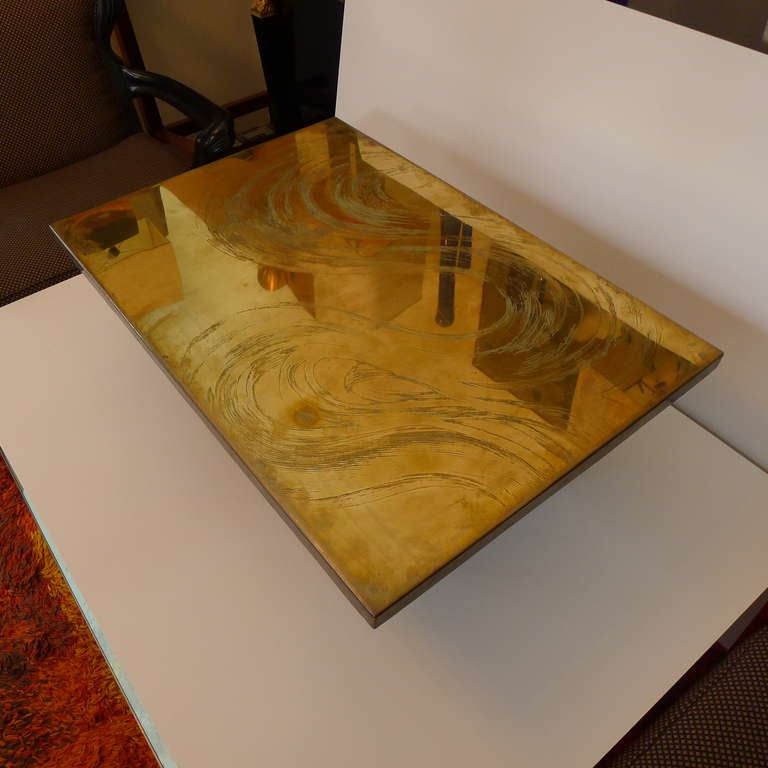 A fine rectangular bronze etched coffee table signed by Christian Heckscher with blackened steel base.